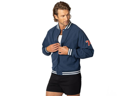 Blue vintage Varsity Bomber Jacket includes tackle twill "74" on the left sleeve, rib-knit collar and cuff, snap front closure, front hand pocket and interior chest pocket, and interior mesh lining.  