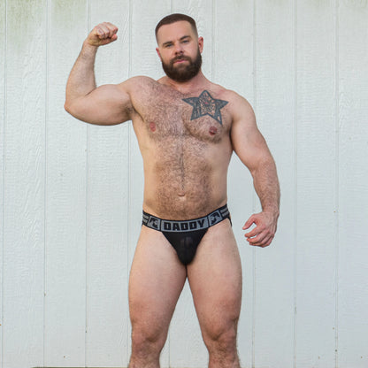 Gruff Pup's Daddy Air Jock has a sheer mesh pouch, bulge boost inner enhancing pouch, and says "Daddy" on the thick, comfortable, black band. 