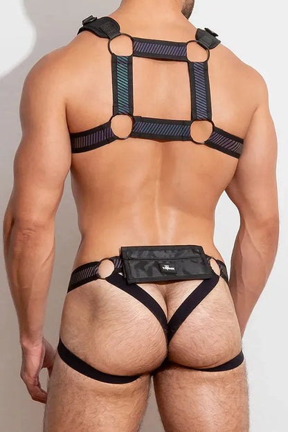 The FlashTECH Pouch Harness is made of retro-reflective fabric. The detachable pouch has velcro closure and zip pockets and can be removed and attached to other FlashTECH pieces.  This fully adjustable harness with silhouette that accentuates your pecs  and shoulders.