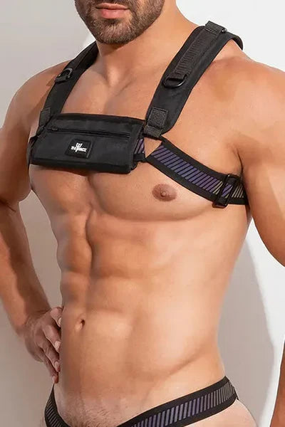 The FlashTECH Pouch Harness is made of retro-reflective fabric. The detachable pouch has velcro closure and zip pockets and can be removed and attached to other FlashTECH pieces.  This fully adjustable harness with silhouette that accentuates your pecs  and shoulders.