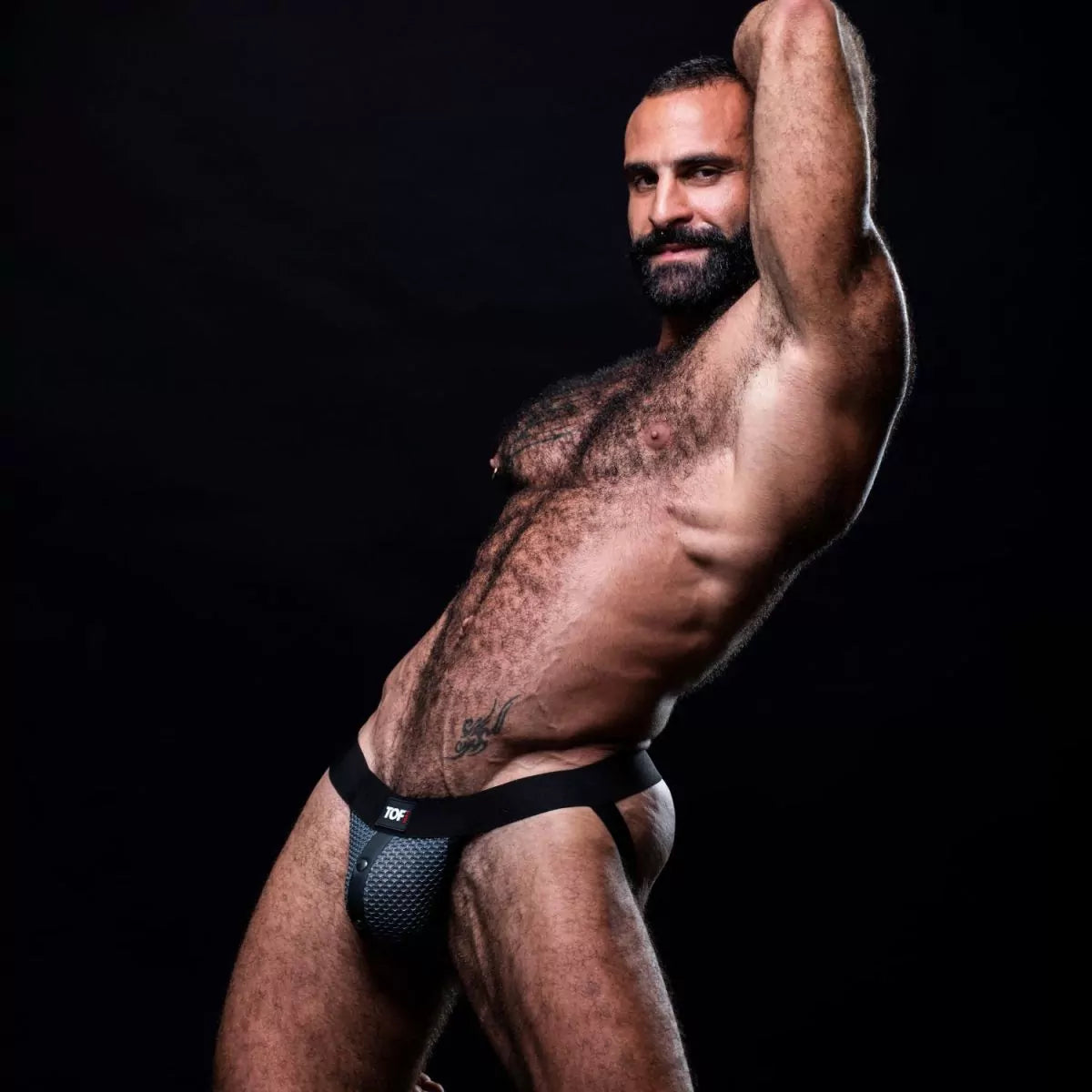 Black and gray snap jockstrap made from breathable 3D mesh.  This jockstrap has a fitted front pocket that snaps in place.