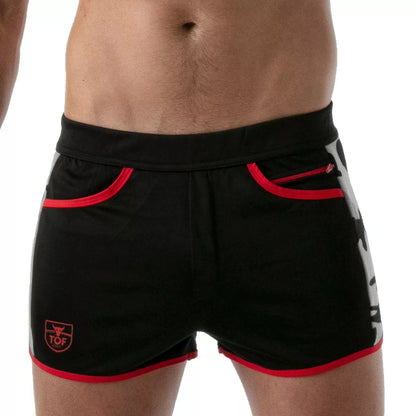 TOF's low-waisted, black sport shorts have camouflage patterned sides, red outline, and pockets including an additional zipper pocket.  The shorts are made of antibacterial microfiber.