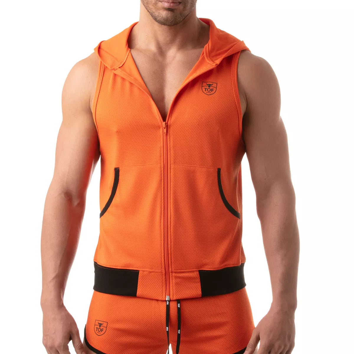 TOF's ultra-light sleeveless hooded jacket is made of polyester microfiber fabric.  This hoodie has pockets, zipper front, and TOFs iconic logo over the chest.